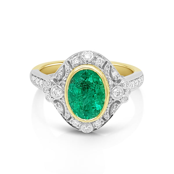 Marika - oval natural emerald and diamond halo dress ring in yellow and white gold