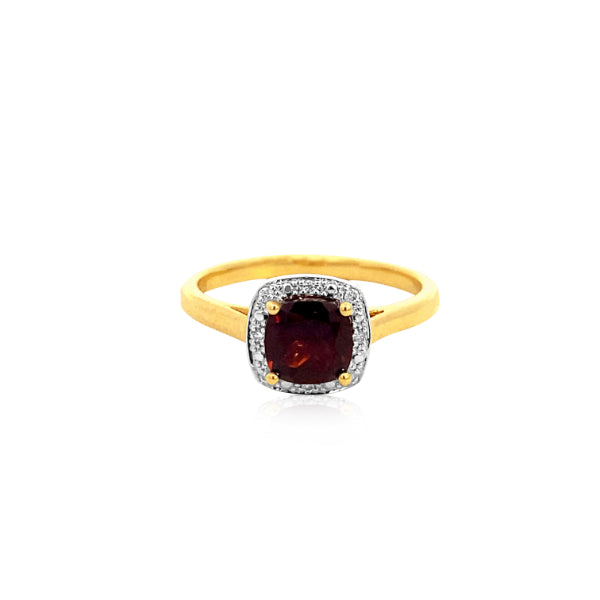 Cushion cut garnet dress ring with diamond halo in 9ct yellow gold