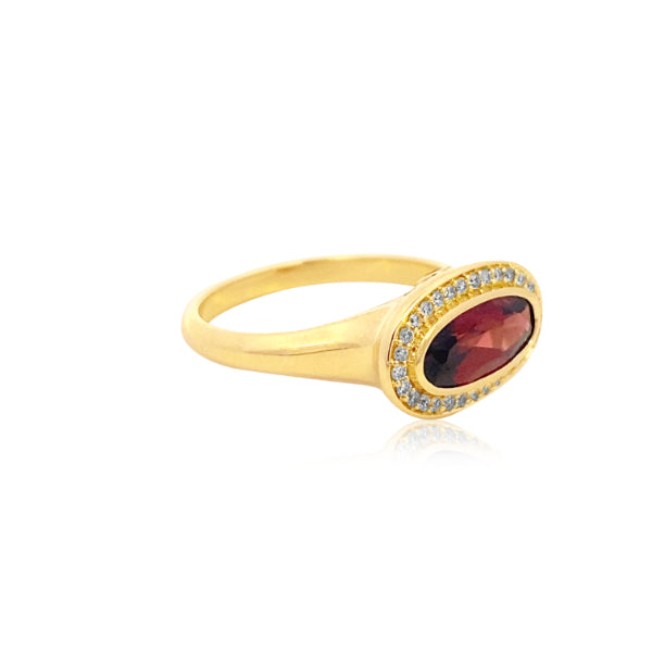 Marlowe - bezel set oval garnet dress ring with diamond halo in 9ct yellow gold