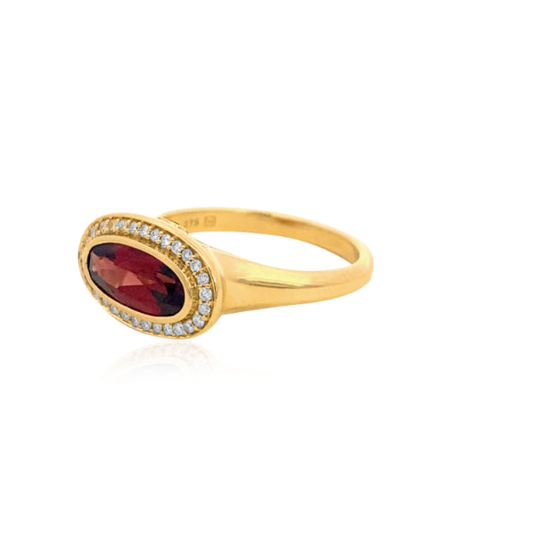 Marlowe - bezel set oval garnet dress ring with diamond halo in 9ct yellow gold