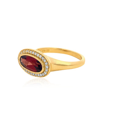 Marlowe- bezel set oval garnet dress ring with diamond halo in 9ct yellow gold