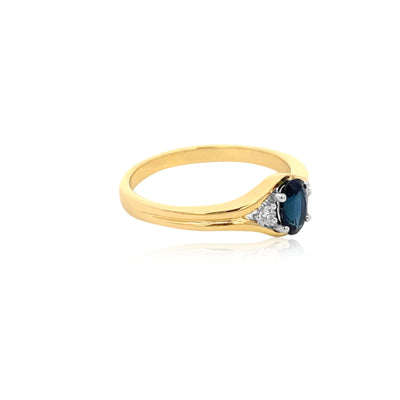 Marina-oval ceylonese sapphire and diamond dress ring in 9ct yellow gold