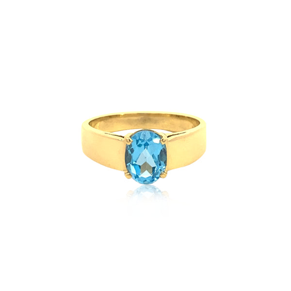 Oval blue topaz ring in 9ct yellow gold