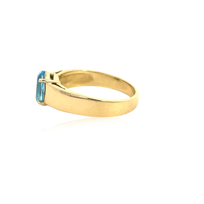 Oval blue topaz ring in 9ct yellow gold