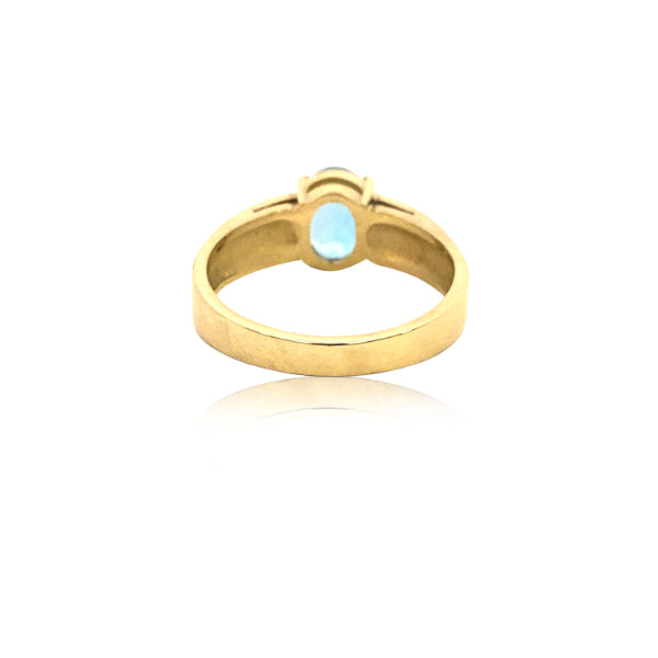 Oval blue topaz ring in 9ct yellow gold