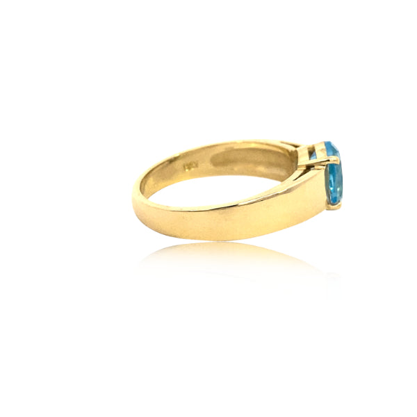 Oval blue topaz ring in 9ct yellow gold