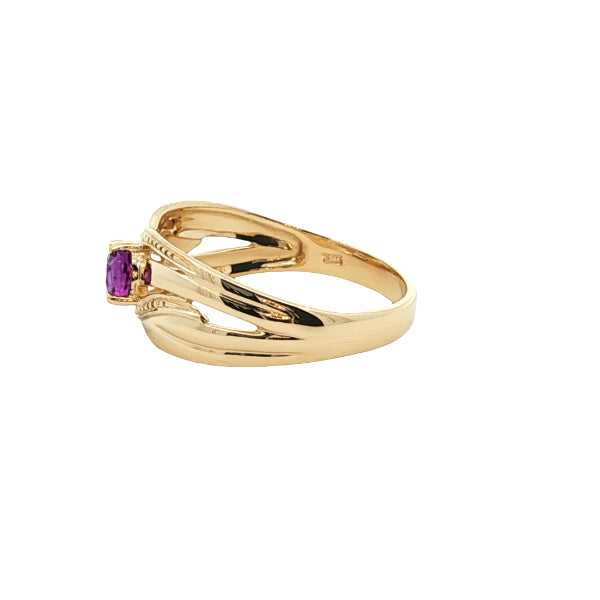 Oval amethyst ring on patterned ribbon band in 9ct yellow gold
