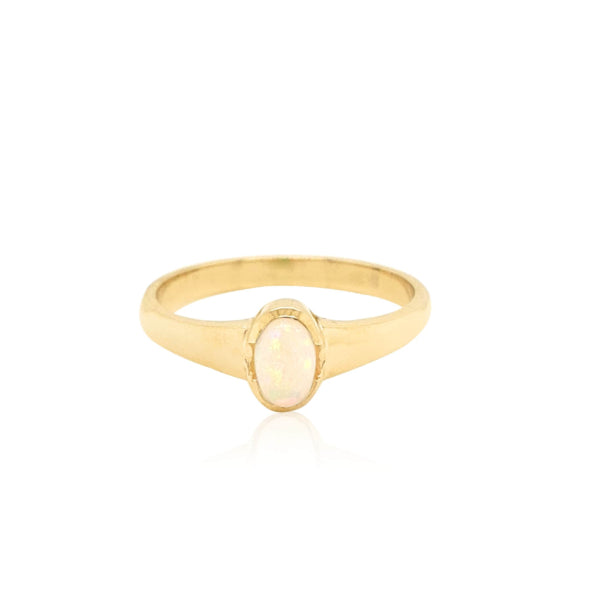 Oval semi rubover opal ring in 9ct yellow gold