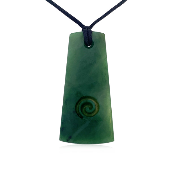 Greenstone toki pendant with carved koru on slider cord
