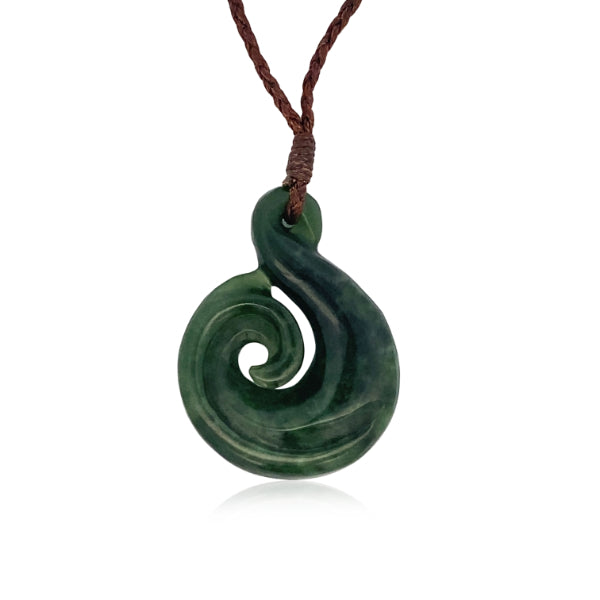 NZ pounamu greenstone twist with koru necklace on brown slider cord