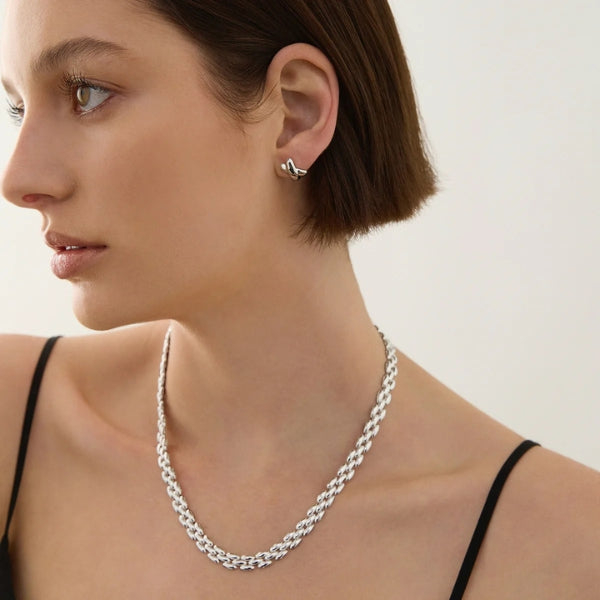 Najo - X shaped kiss stud earrings in sterling silver