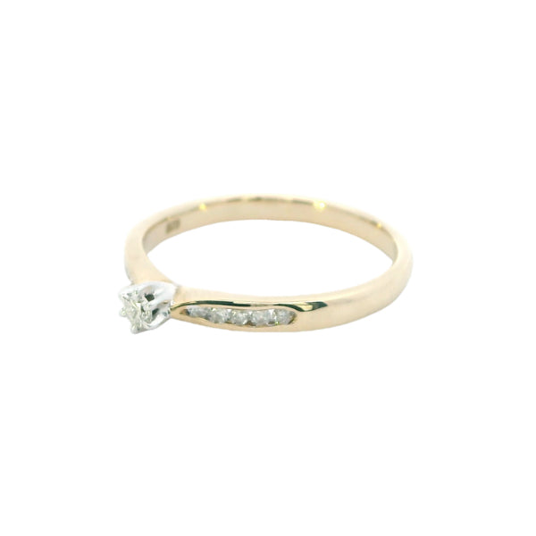 Diamond solitaire engagement ring with channel set diamond shoulders in 9ct gold