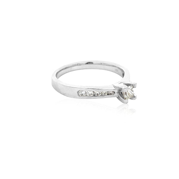 Yoko - 18ct white gold princess cut diamond solitaire engagement ring with diamond channel set shoulder stones