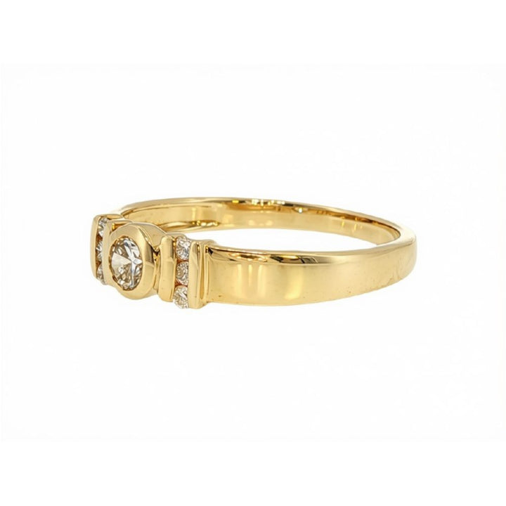 7 stone rubover daimond ring in 9ct yellow gold