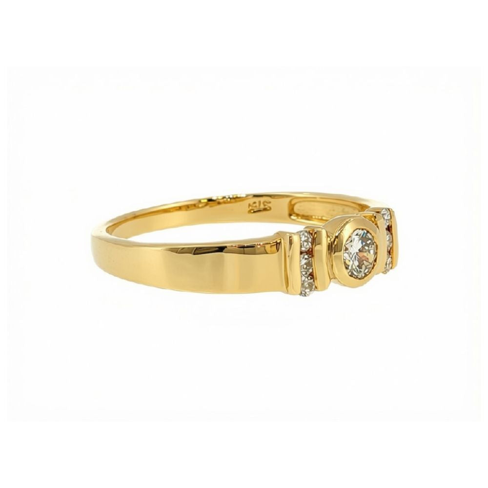 7 stone rubover daimond ring in 9ct yellow gold