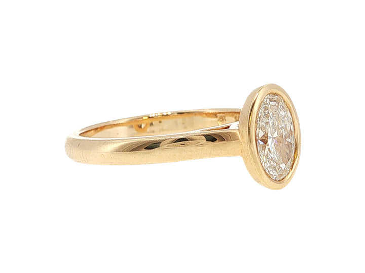 Lesia - one carat oval lab-grown diamond solitaire in 9ct yellow gold rubover setting