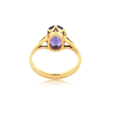Oval claw set amethyst ring in 9ct yellow gold