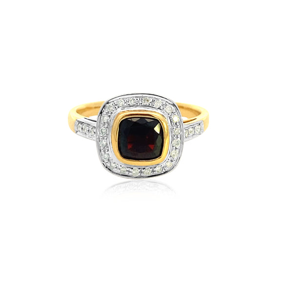 Cushion cut garnet and diamond halo dress ring in 9ct yellow gold