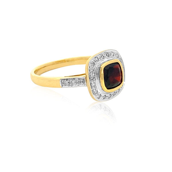 Cushion cut garnet and diamond halo dress ring in 9ct yellow gold