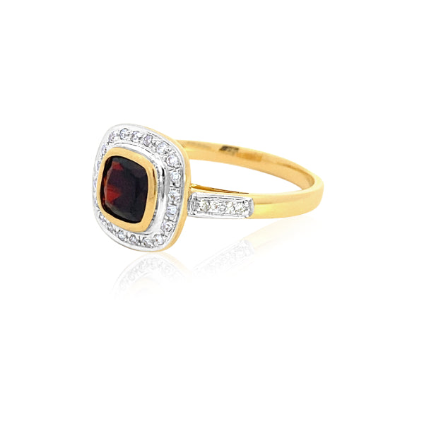 Cushion cut garnet and diamond halo dress ring in 9ct yellow gold