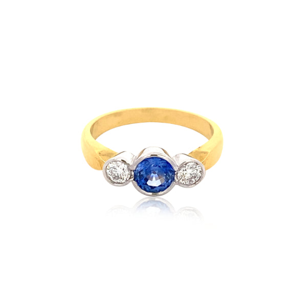 Reka - round ceylon sapphire and diamond three stone ring in 18ct yellow gold.