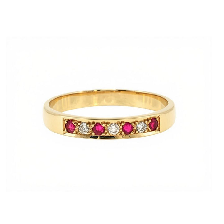 Ruby and three stone diamond bead set ring in 9ct yellow gold