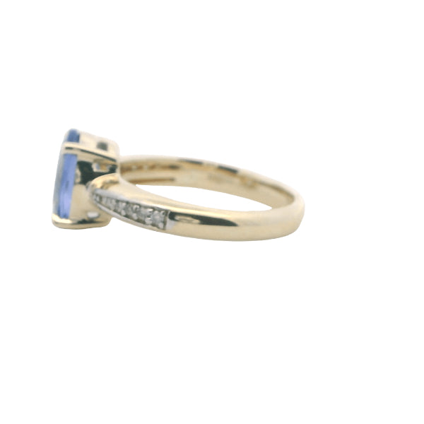 Tanzanite and diamond ring in 9ct yellow gold