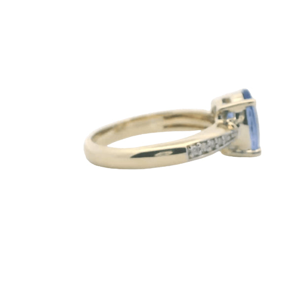 Tanzanite and diamond ring in 9ct yellow gold