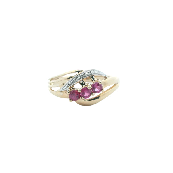 Ruby and diamond dress ring in 9ct yellow gold