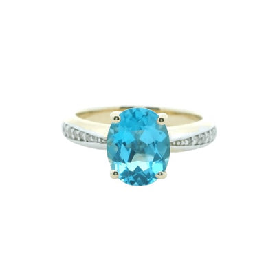 Blue topaz and diamond dress ring in 9ct yellow gold