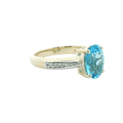 Blue topaz and diamond dress ring in 9ct yellow gold