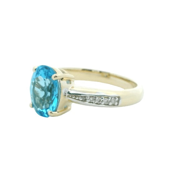 Blue topaz and diamond dress ring in 9ct yellow gold