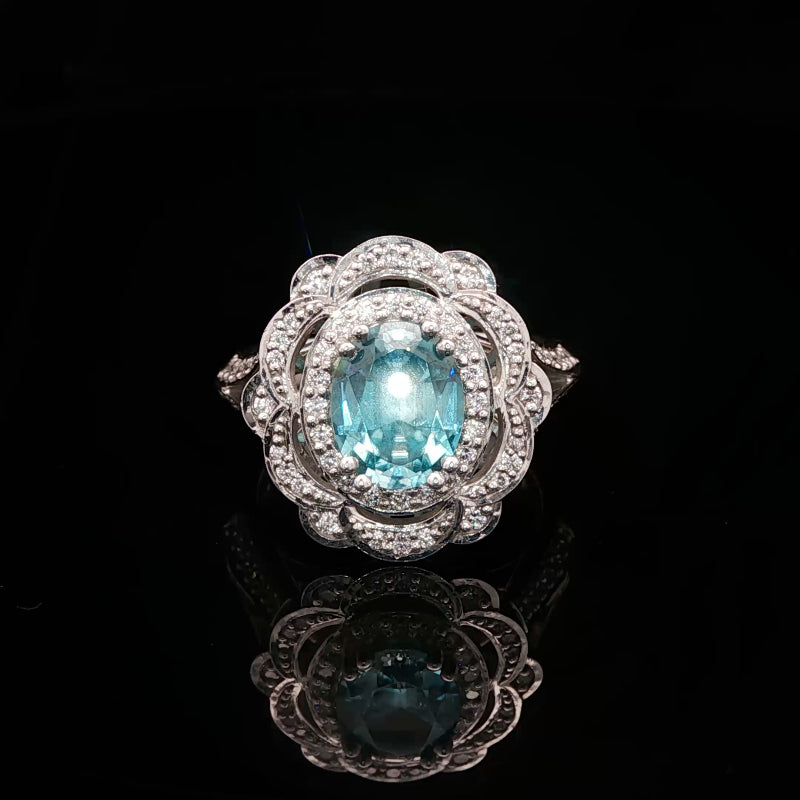 Hine - Blue zircon & diamond halo ring in 18ct white gold
