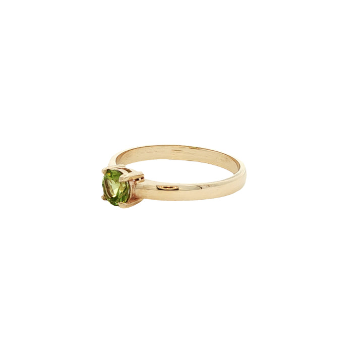Round peridot dress ring in 9ct yellow gold
