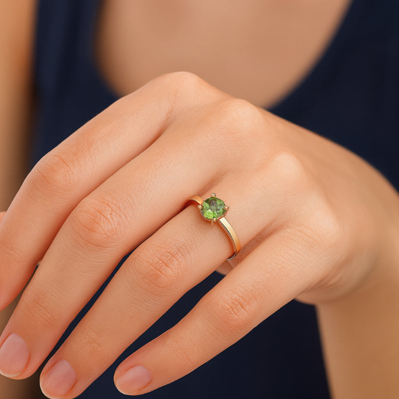 Round peridot dress ring in 9ct yellow gold