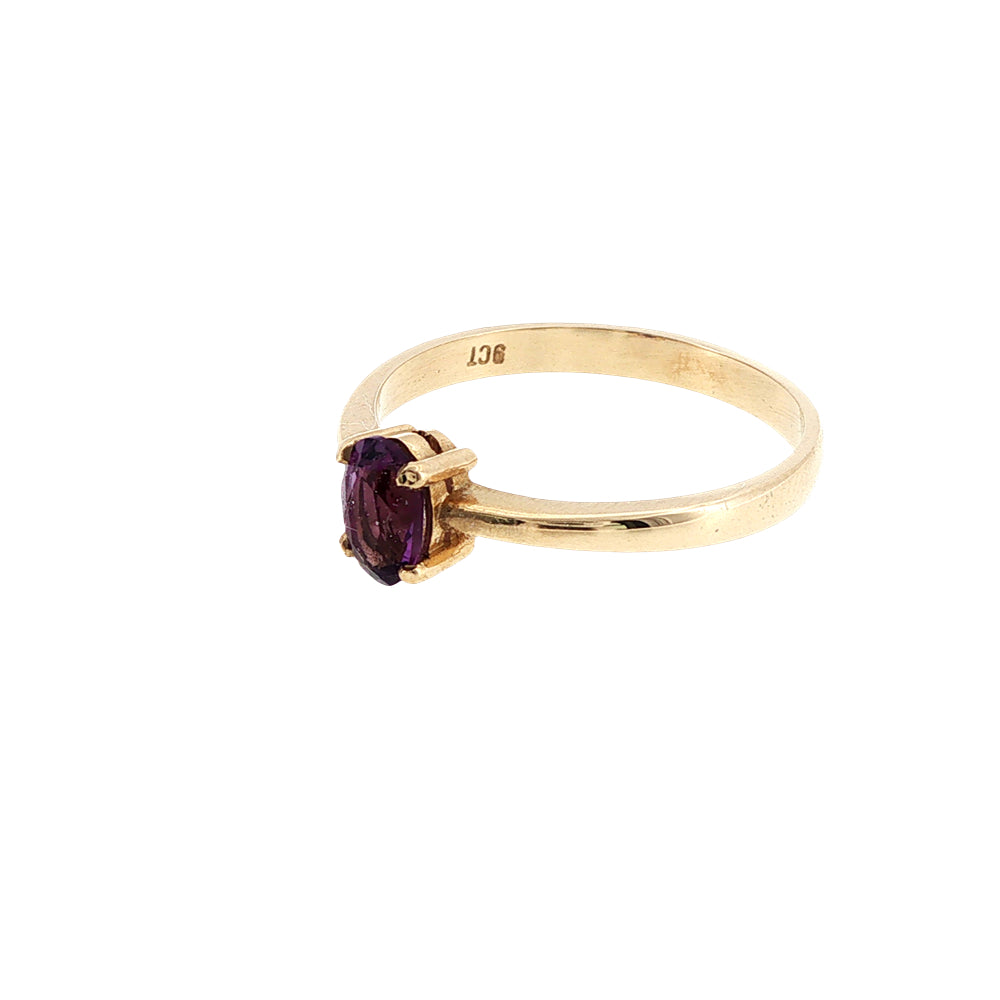 Oval amethyst solitaire ring in 9ct yellow gold