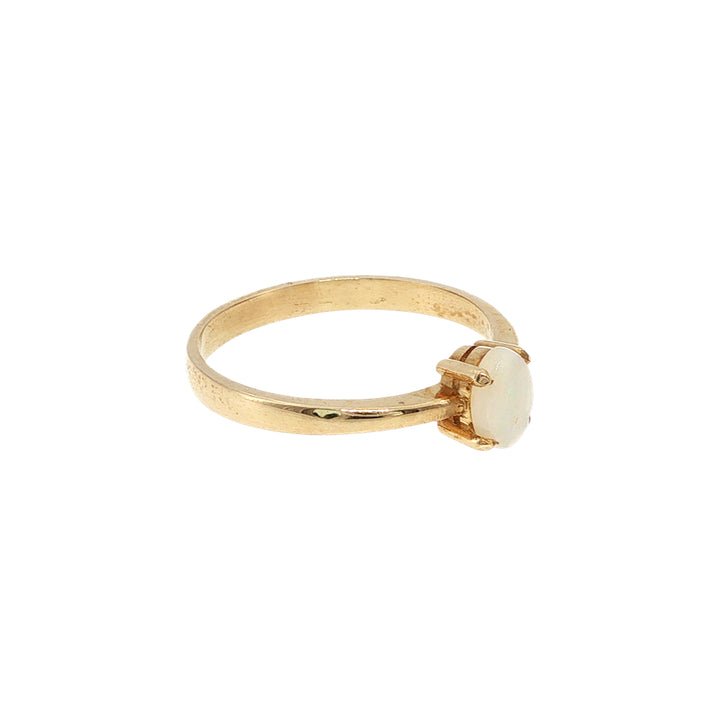 Australian opal claw set ring in 9ct yellow gold