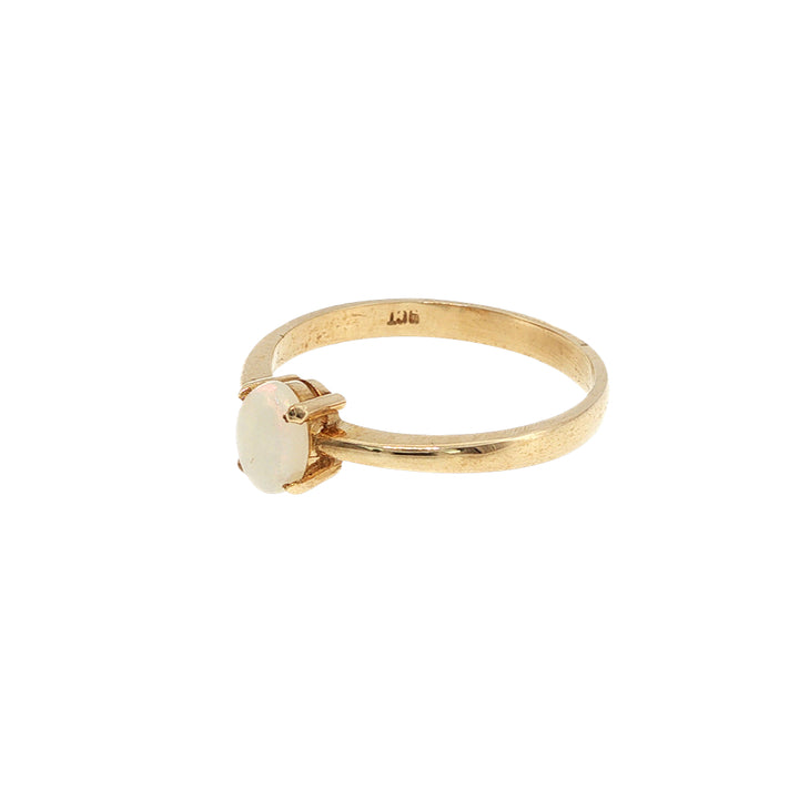Australian opal claw set ring in 9ct yellow gold