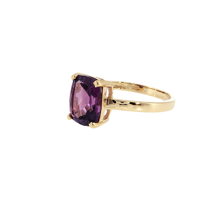 Cushion cut amethyst solitaire ring in 9ct yellow gold