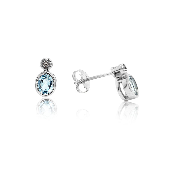 Blue topaz and diamond rubover stud earrings in 9ct white gold