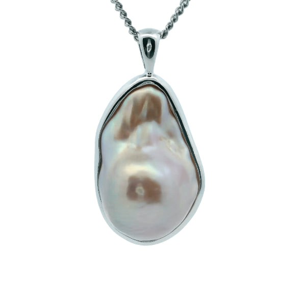 Natural pink baroque freshwater pearl pendant in sterling silver frame