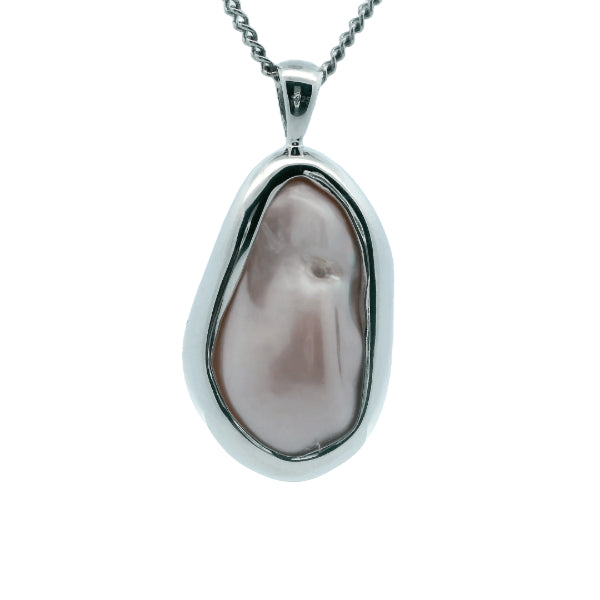Natural pink baroque freshwater pearl pendant in sterling silver frame