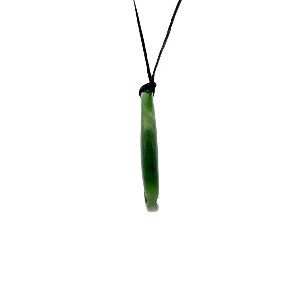 NZ pounamu greenstone medium round pendant with koru on slider cord