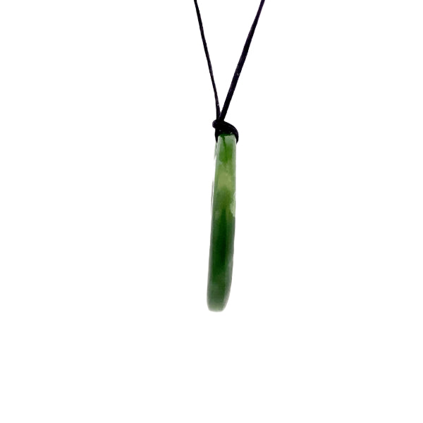 NZ pounamu greenstone medium round pendant with koru on slider cord
