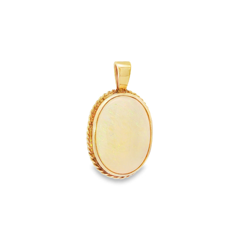 Rope edged oval australian opal pendant in 9ct yellow gold