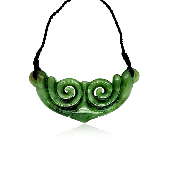 NZ pounamu greenstone koru breastplate on braided slider cord