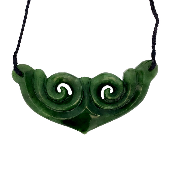 NZ pounamu greenstone koru breastplate on braided slider cord