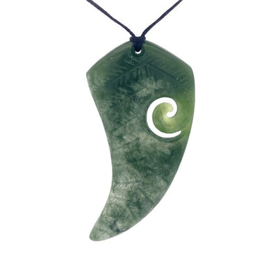 NZ pounamu greenstone fern shaped with koru