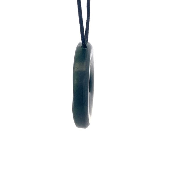 NZ pounamu greenstone circle with triple koru on slider cord