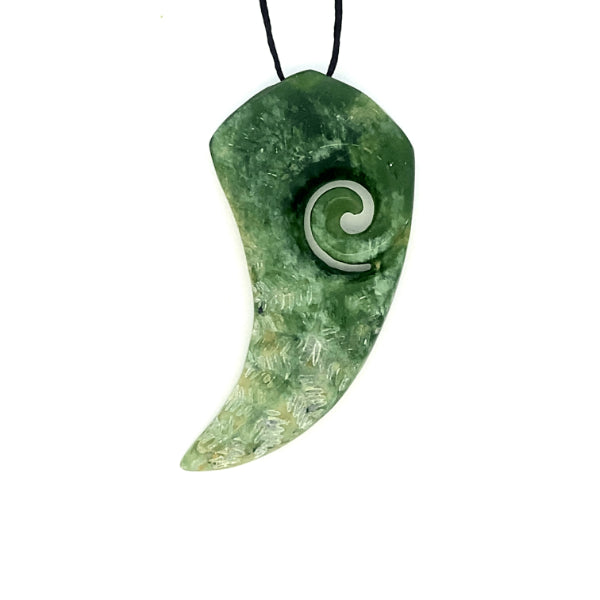 NZ pounamu greenstone fern shaped with koru